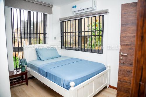 Ένα ή περισσότερα κρεβάτια σε δωμάτιο στο Container Home Retreat