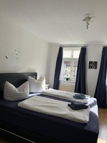 Ένα ή περισσότερα κρεβάτια σε δωμάτιο στο Ferienwohnung Agora inkl Parkplatz