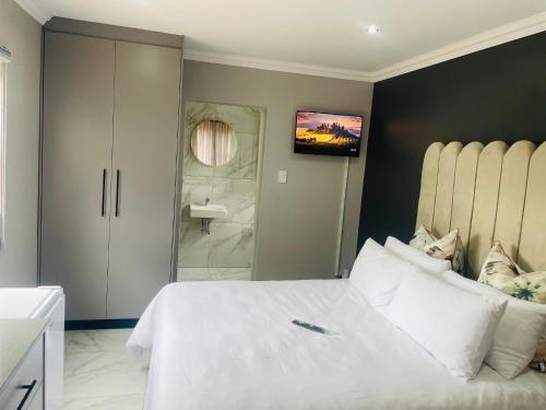 Postel nebo postele na pokoji v ubytování Ziyacebisa Group Apartments