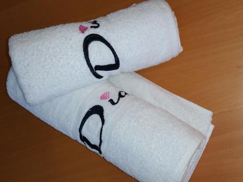three rolls of toilet paper sitting on a table at Diamonds Villa in York