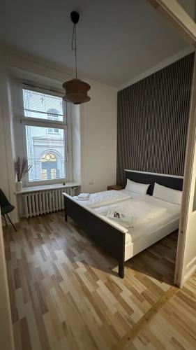 Postel nebo postele na pokoji v ubytování Ostsee Hotel Lübeck