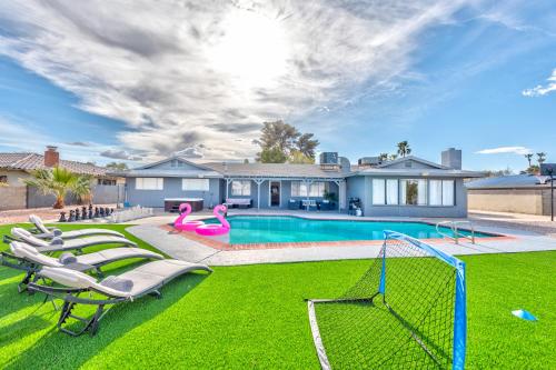a house with a swimming pool with lawn chairs at Vila Hearts in Las Vegas