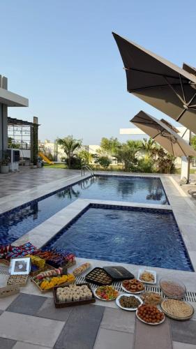 Piscina a شاليه هوانا o a prop