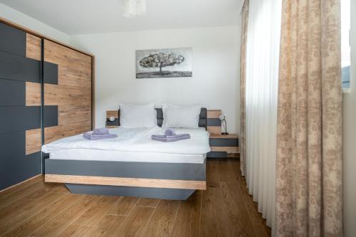 Postel nebo postele na pokoji v ubytování Ville Novak Villaggio by Adex Travel