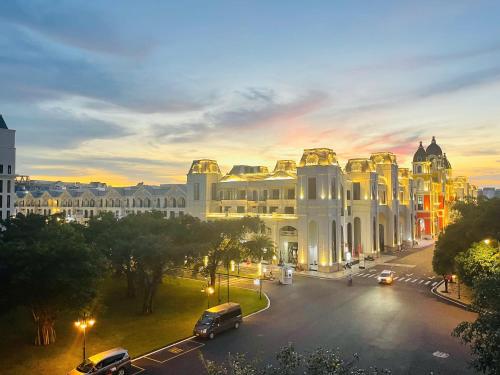 a city street with a large white building at Soffia Hotel in Phu Quoc