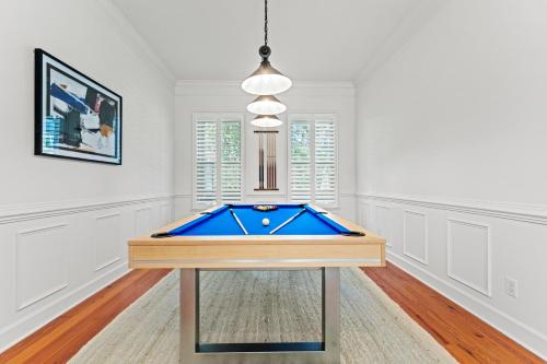 a pool table in the middle of a room at Cane Current in Hilton Head Island