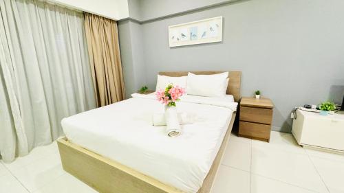 Postel nebo postele na pokoji v ubytování Mercu Summer Suites by SUN