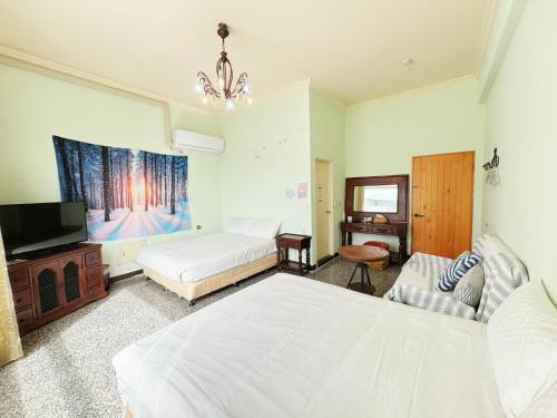 Postel nebo postele na pokoji v ubytování 花蓮羽竹民宿 -附車位-