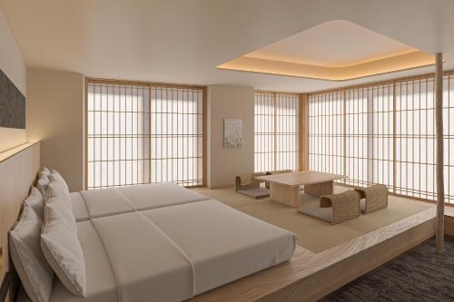 Ένα ή περισσότερα κρεβάτια σε δωμάτιο στο Hotel Fork & Knife Miyajima