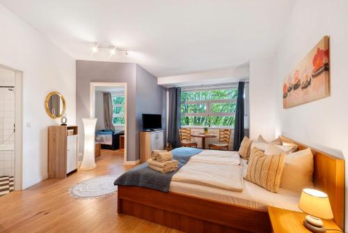 a bedroom with a large bed in a room at Albrechtshof in Neu Fahrland