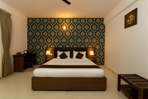 Postel nebo postele na pokoji v ubytování Sai Bliss International, Manyata Tech Park