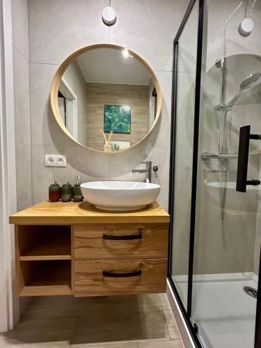 a bathroom with a sink and a mirror at Colorado in Gdańsk