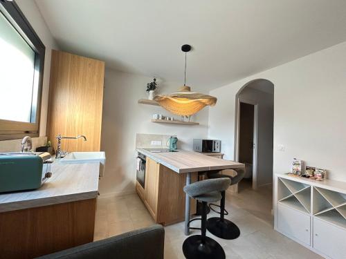 a kitchen with a table and a chair in it at St Paul de Vence in Cagnes-sur-Mer