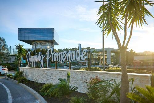 a sign in front of a shopping center at St Paul de Vence in Cagnes-sur-Mer