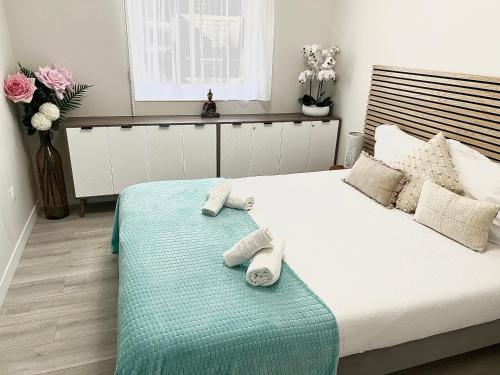 a bedroom with a bed with towels on it at Paradistay in Cannes