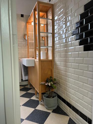 a bathroom with a sink and a mirror at Characteristic Dutch home in historic center Gouda in Gouda
