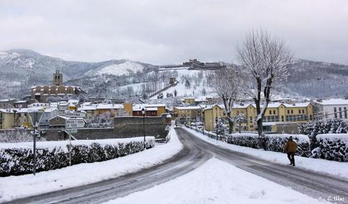 a person walking down a snow covered road at Total Peace and quiet on the top of the mountain, in Prats-de-Mollo-la-Preste