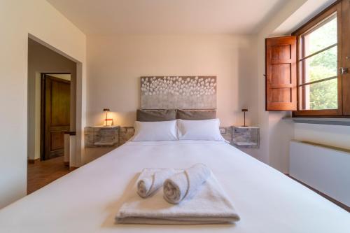 Ένα ή περισσότερα κρεβάτια σε δωμάτιο στο Antico Borgo Delle Rose