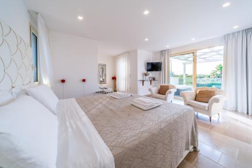 En eller flere senge i et værelse på Villa Anciletta