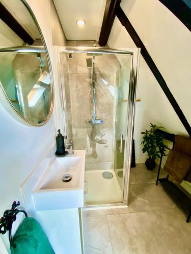 a bathroom with a shower and a sink at Fabulous Converted Church Apartment Town Centre in Worthing