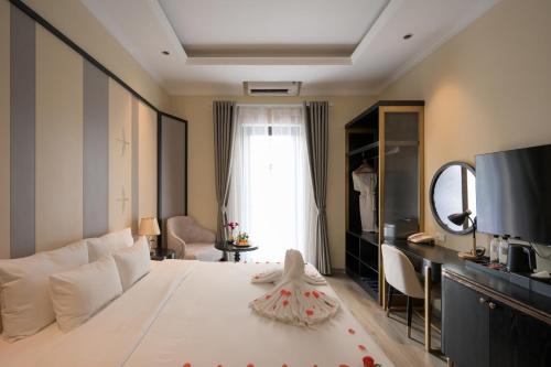 Postel nebo postele na pokoji v ubytování San Hotel & Pool