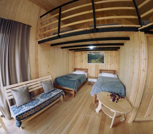 Ένα ή περισσότερα κρεβάτια σε δωμάτιο στο Guesthouse Omalo