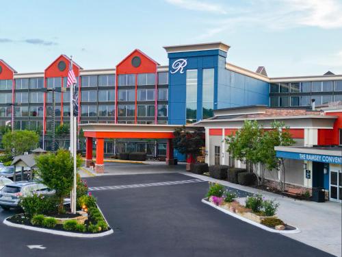 an empty parking lot in front of a building at The Ramsey Hotel and Convention Center Pigeon Forge in Pigeon Forge