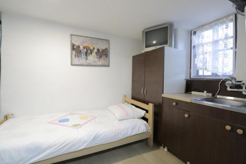 Postel nebo postele na pokoji v ubytování Etno Deša Apartmani