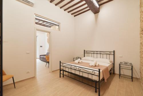 a bedroom with a bed with two towels on it at AM10 - Modern flat in historic center in Perugia