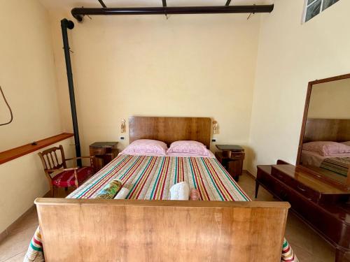 Postel nebo postele na pokoji v ubytování Dimora - L antico Fienile del Castello