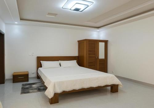 Ένα ή περισσότερα κρεβάτια σε δωμάτιο στο Villa Serenite