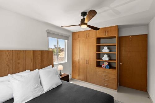 a bedroom with a bed and a ceiling fan at Centrally located and comfortable apartment! in Cabo San Lucas