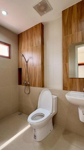 a bathroom with a toilet and a sink at The Lodge at Koh Kood in Ko Kood