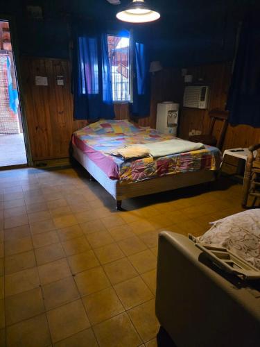 Ένα ή περισσότερα κρεβάτια σε δωμάτιο στο alojamiento Villa sarita