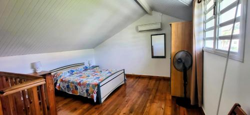 Postel nebo postele na pokoji v ubytování les jardins de sainte Anne