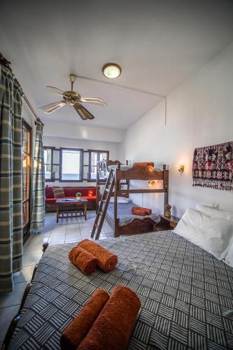 a bedroom with a bed with two towels on it at Hotel Hagiati in Chorefto