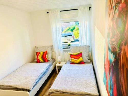 Ένα ή περισσότερα κρεβάτια σε δωμάτιο στο MOLA Apartments - Panoramablick, Balkon, 5 Pers, Bahnhofsnähe, Parkplatz