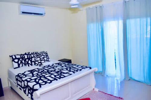 Postel nebo postele na pokoji v ubytování Casa Bayaguana Real