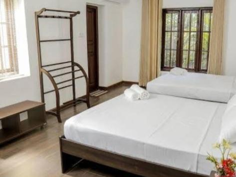 Postel nebo postele na pokoji v ubytování Villa Kengalle