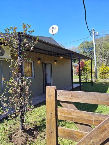 a wooden fence in front of a house at Beautiful Quinta in Corrientes in Paso de la Patria
