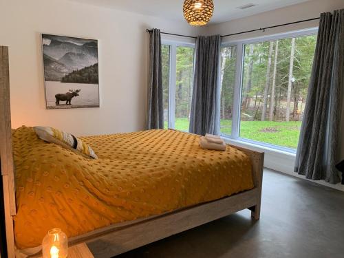 Giường trong phòng chung tại Chalet Nature de Charlevoix