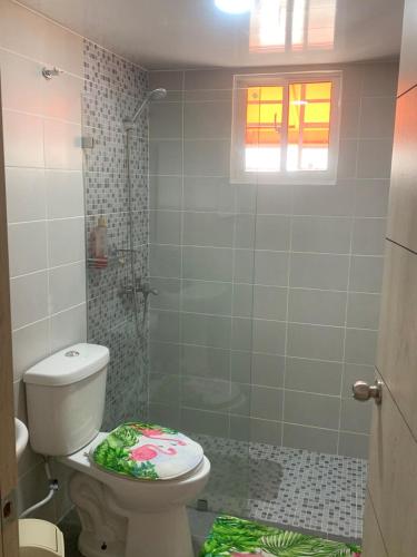 a bathroom with a toilet and a shower at Comfort and tranquility in one place in La Estrella