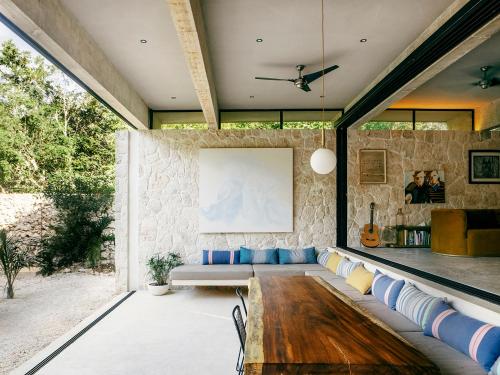 a living room with a couch and a table at Casa M in Macario Gomez