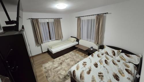 Postel nebo postele na pokoji v ubytování Casa Ghighiu