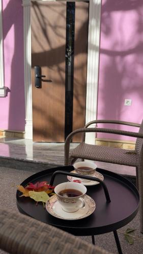 a tray with a cup of tea on a table at MK Luxury Serviced Apartment # 2 in Chişinău