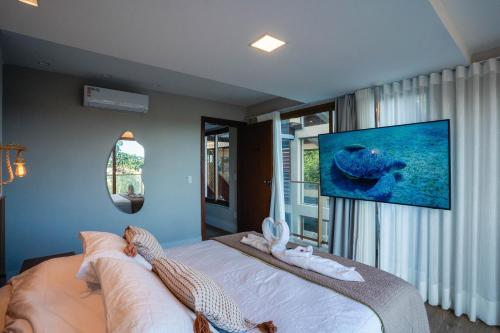 TV a/nebo společenská místnost v ubytování Casa Oceano- Praia do Forte