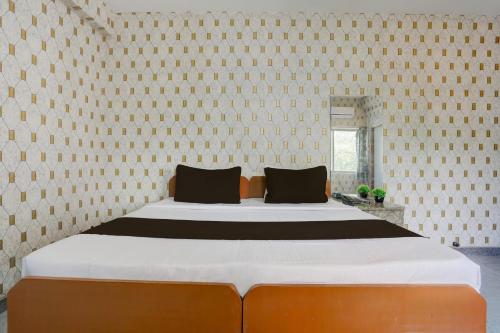 Ένα ή περισσότερα κρεβάτια σε δωμάτιο στο Hotel O Executive Inn