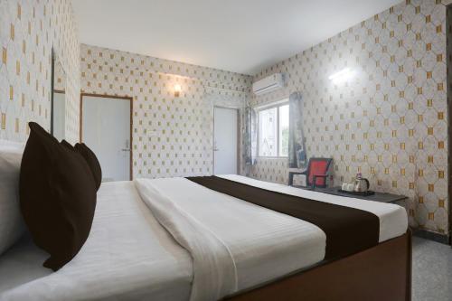 Ένα ή περισσότερα κρεβάτια σε δωμάτιο στο Hotel O Executive Inn