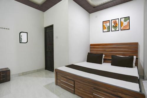 Ένα ή περισσότερα κρεβάτια σε δωμάτιο στο Hotel O stay inn