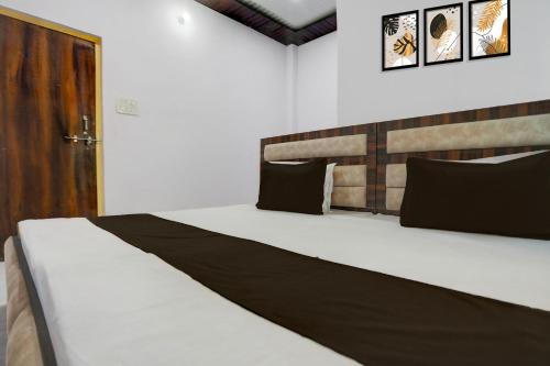 Ένα ή περισσότερα κρεβάτια σε δωμάτιο στο Hotel O stay inn